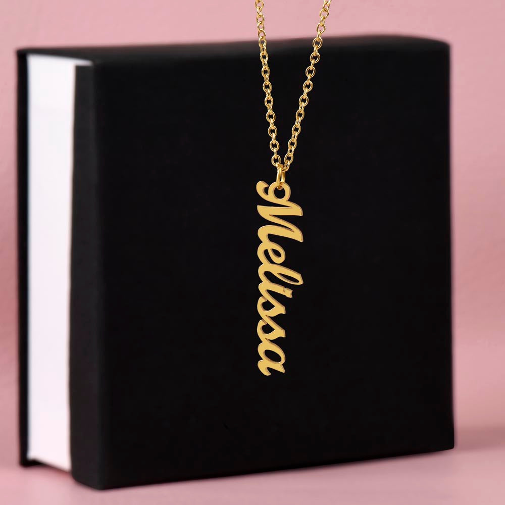 vertical gold name necklace and gift box